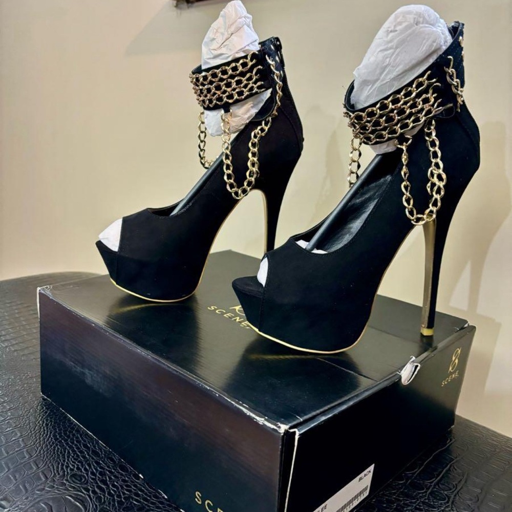 Black pumps with gold chains. Size 10.